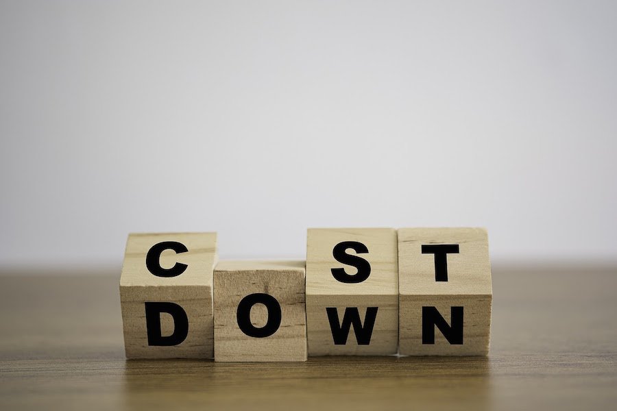 Building blocks flipping to spell “Cost down